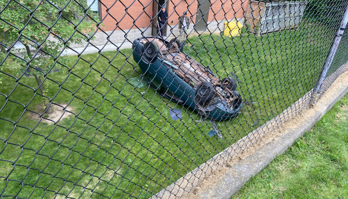 ‘Vehicle went over fence and is upside down:’ Police respond to crash in Dundas